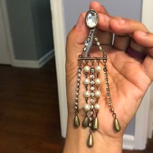 Long dangly clip-on earrings.